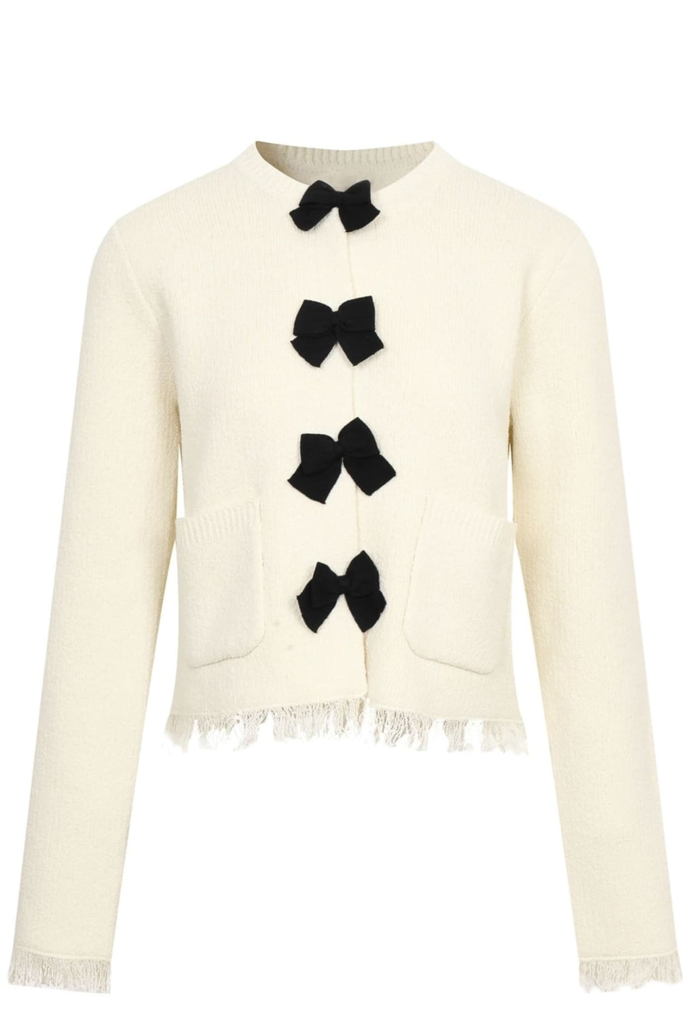 Cream knit cardigan with black bows and front pockets.