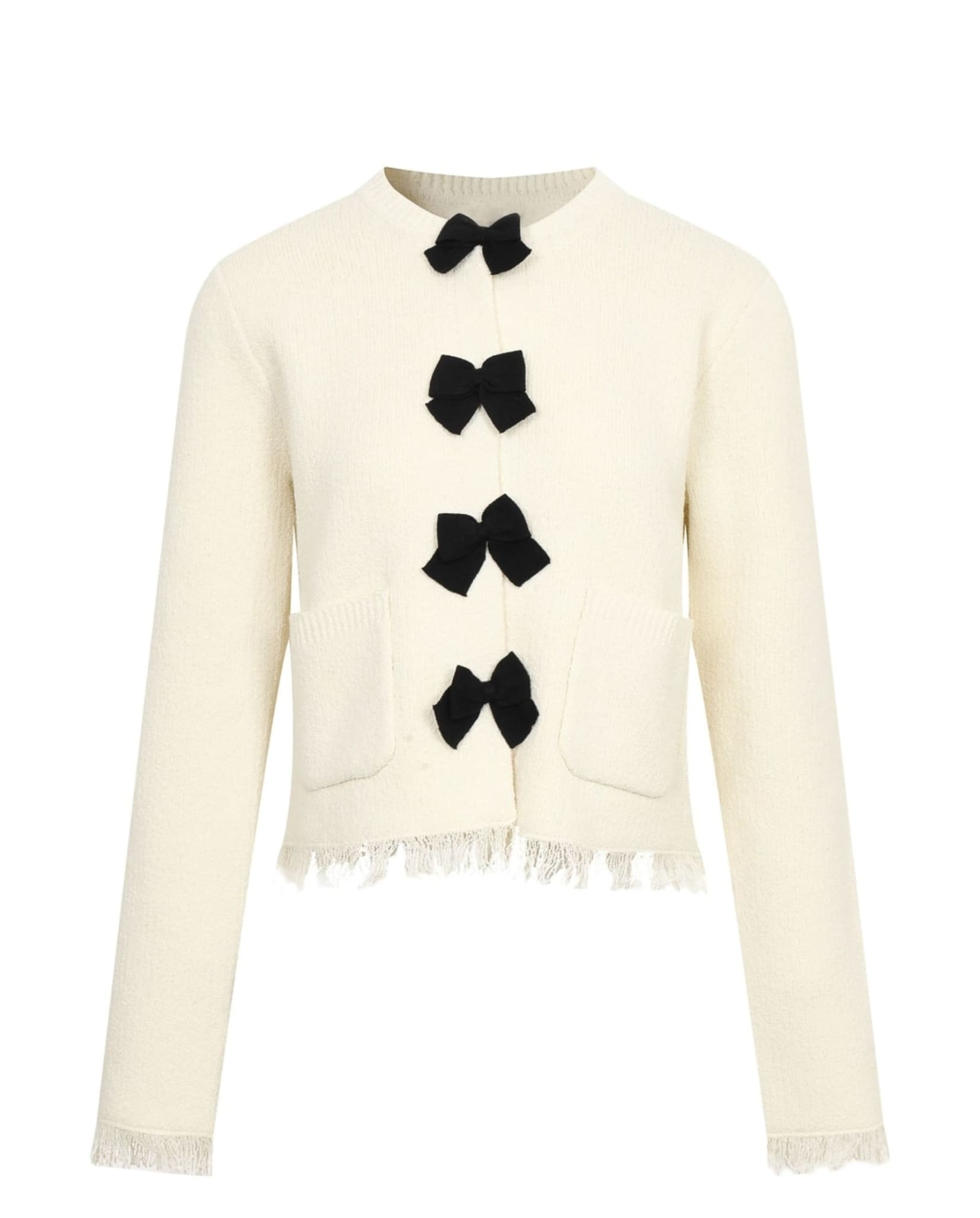 Cream knit cardigan with black bows and front pockets.