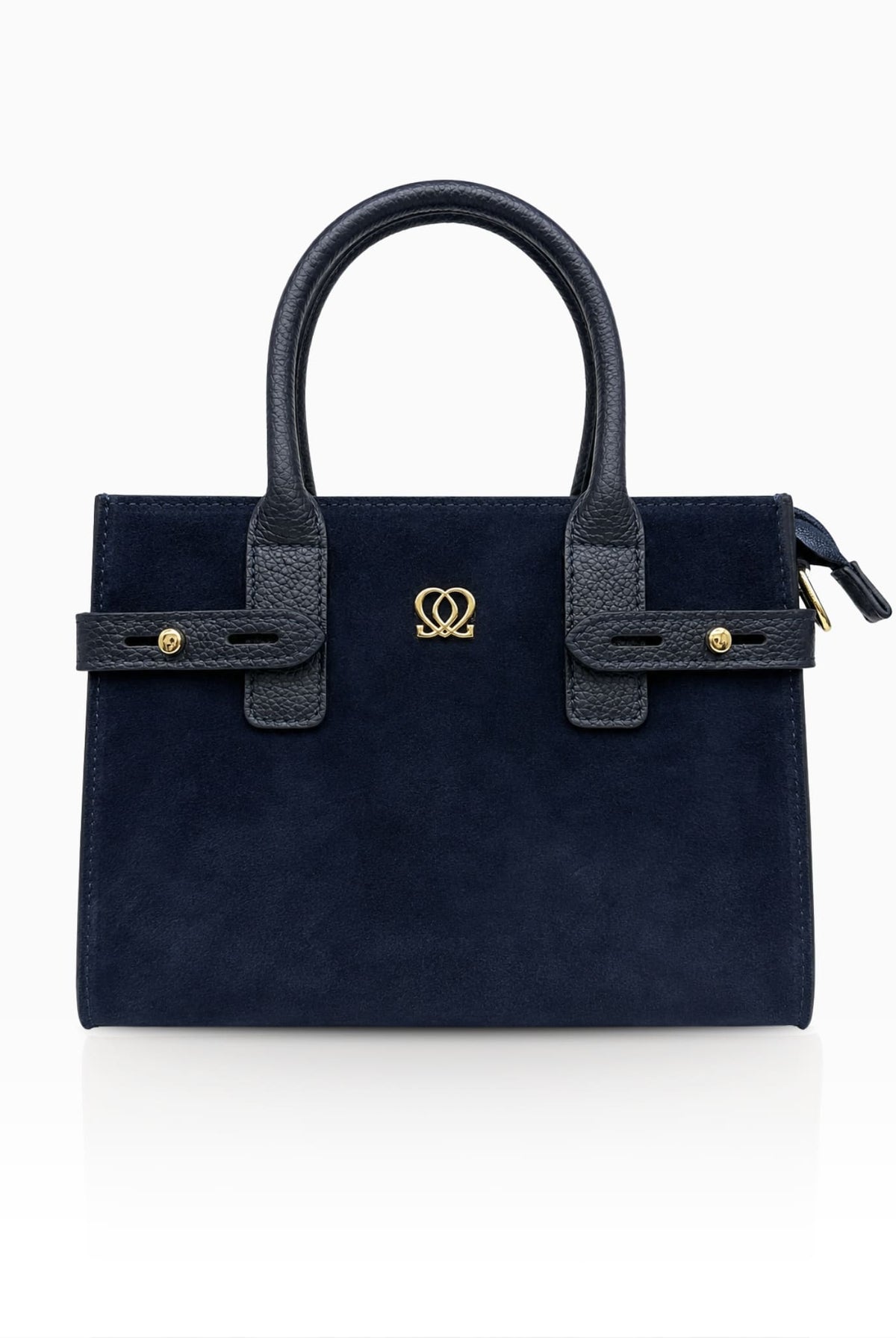 Navy leather handbag with suede front panel and gold-tone detailing.