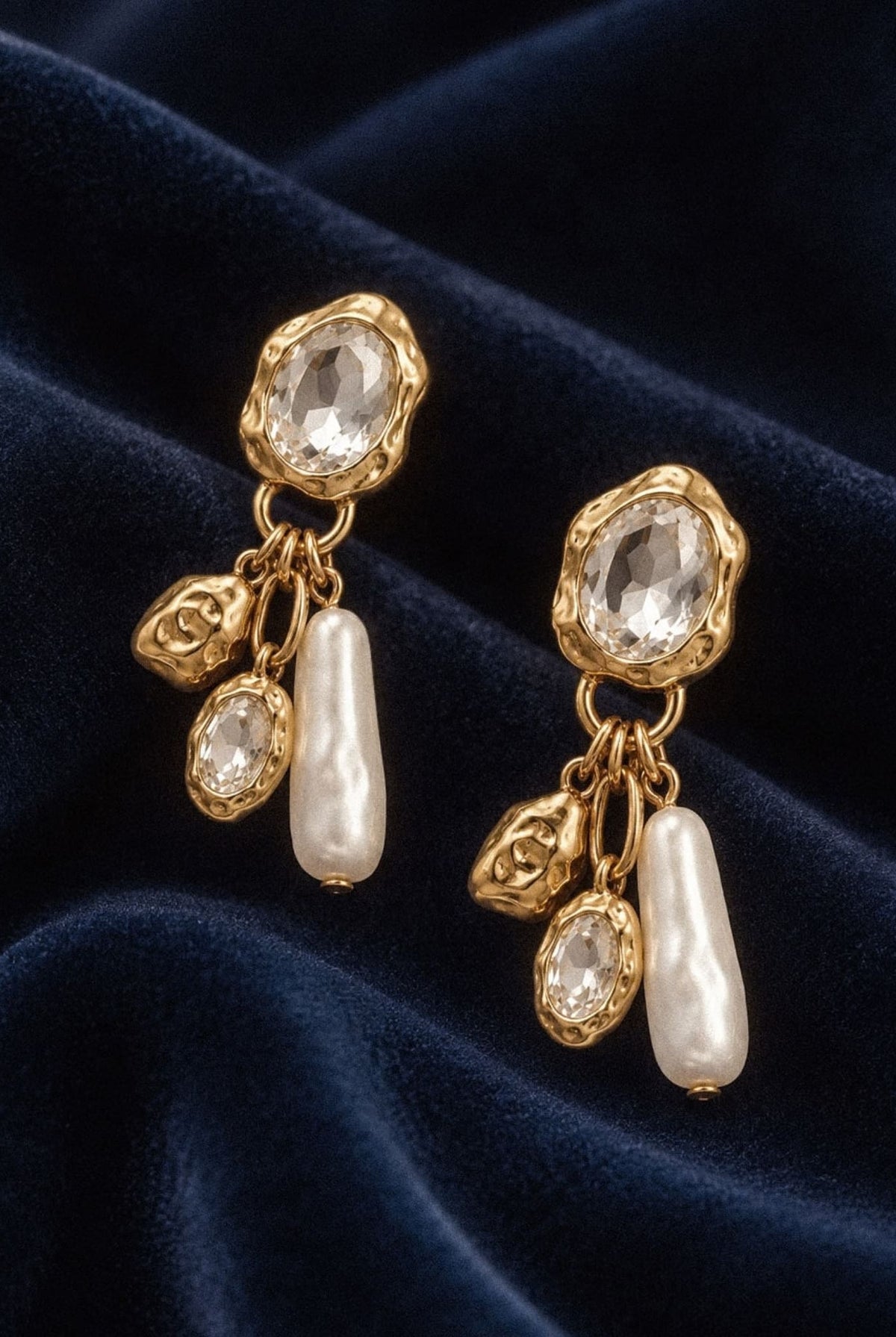 Crystal & Pearl Drop Earrings with clear crystals and pearl drops on navy velvet.