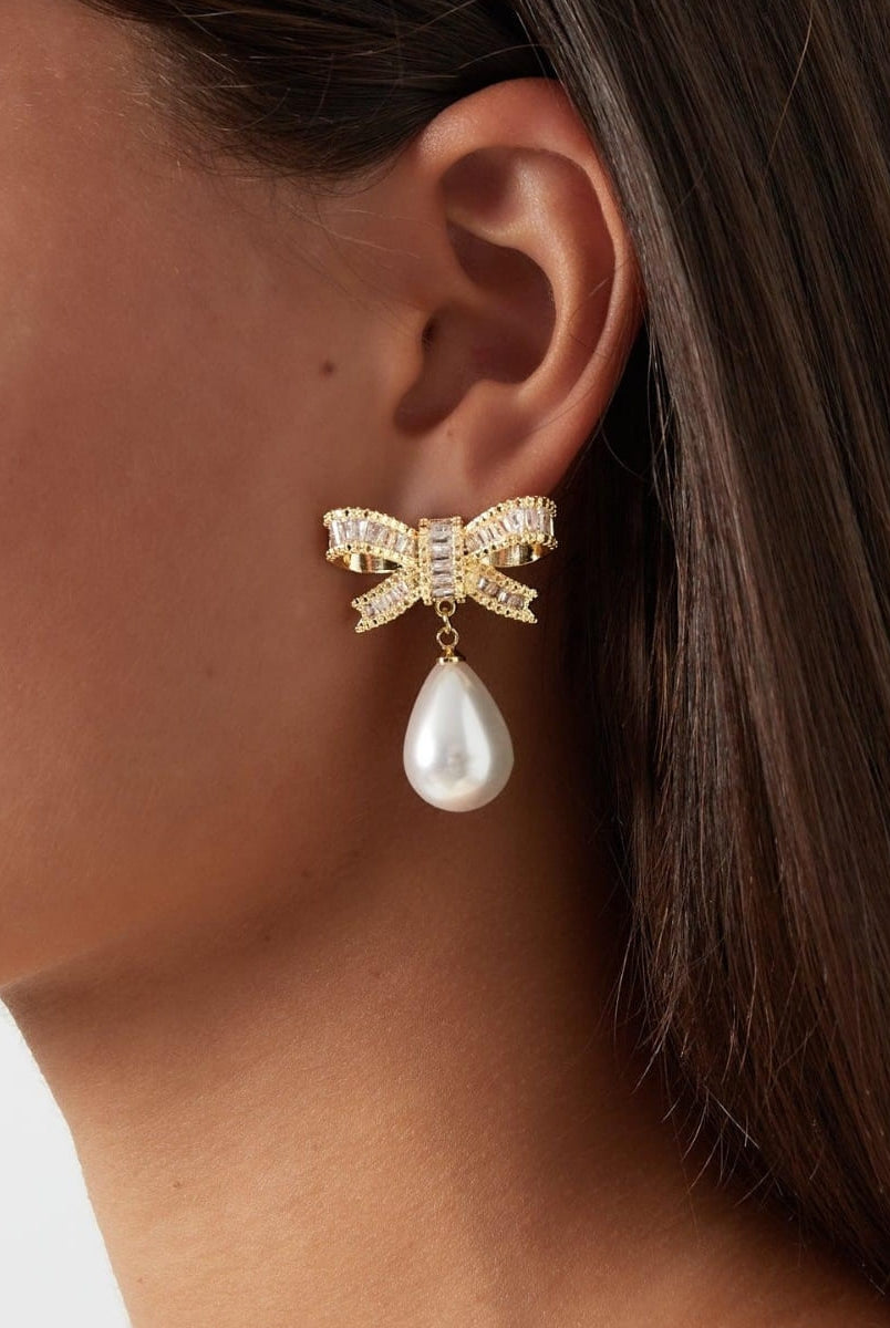Image showcasing a stunning bowknot earring from Coventina Collection