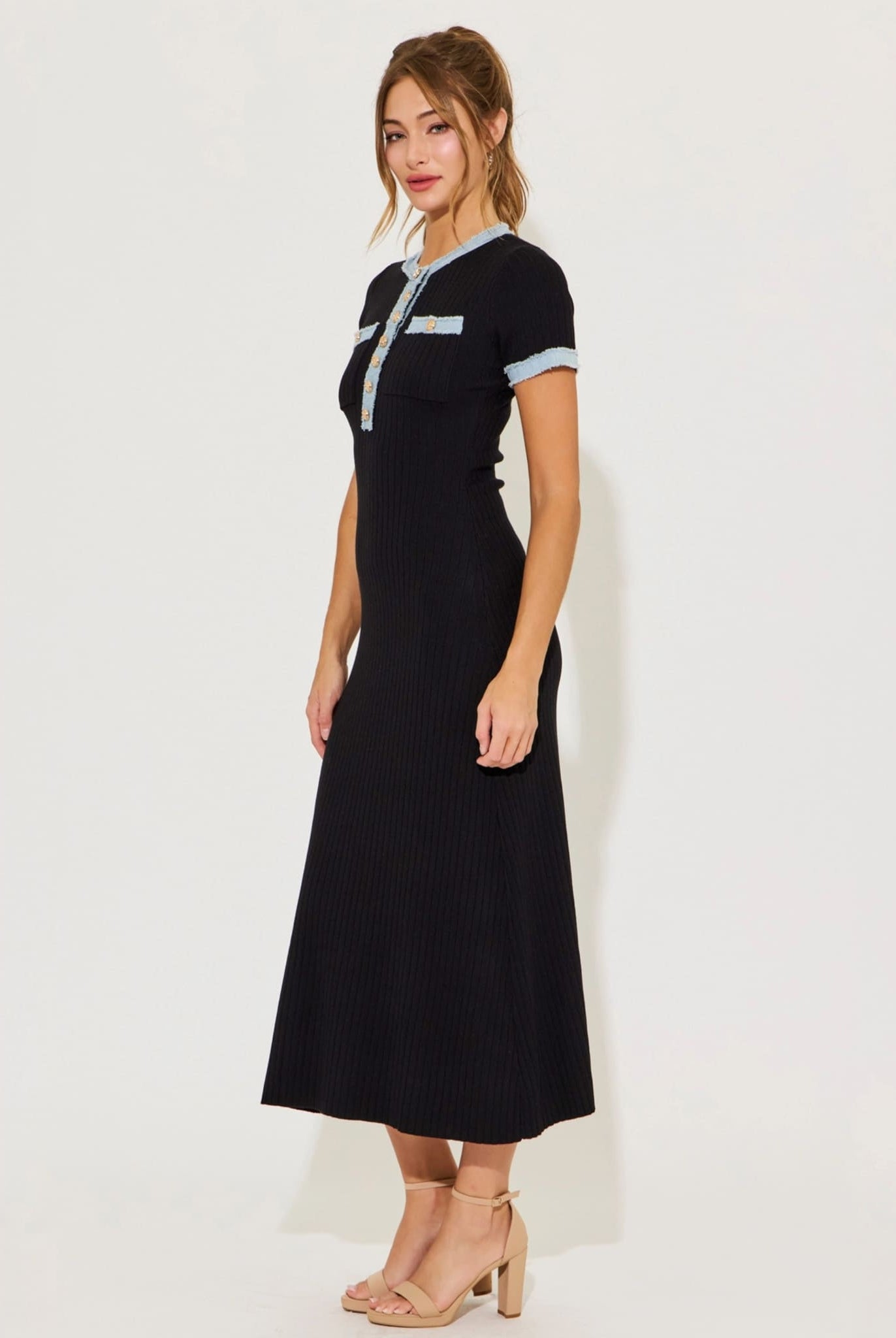 Black ribbed knit dress side view with short sleeves.