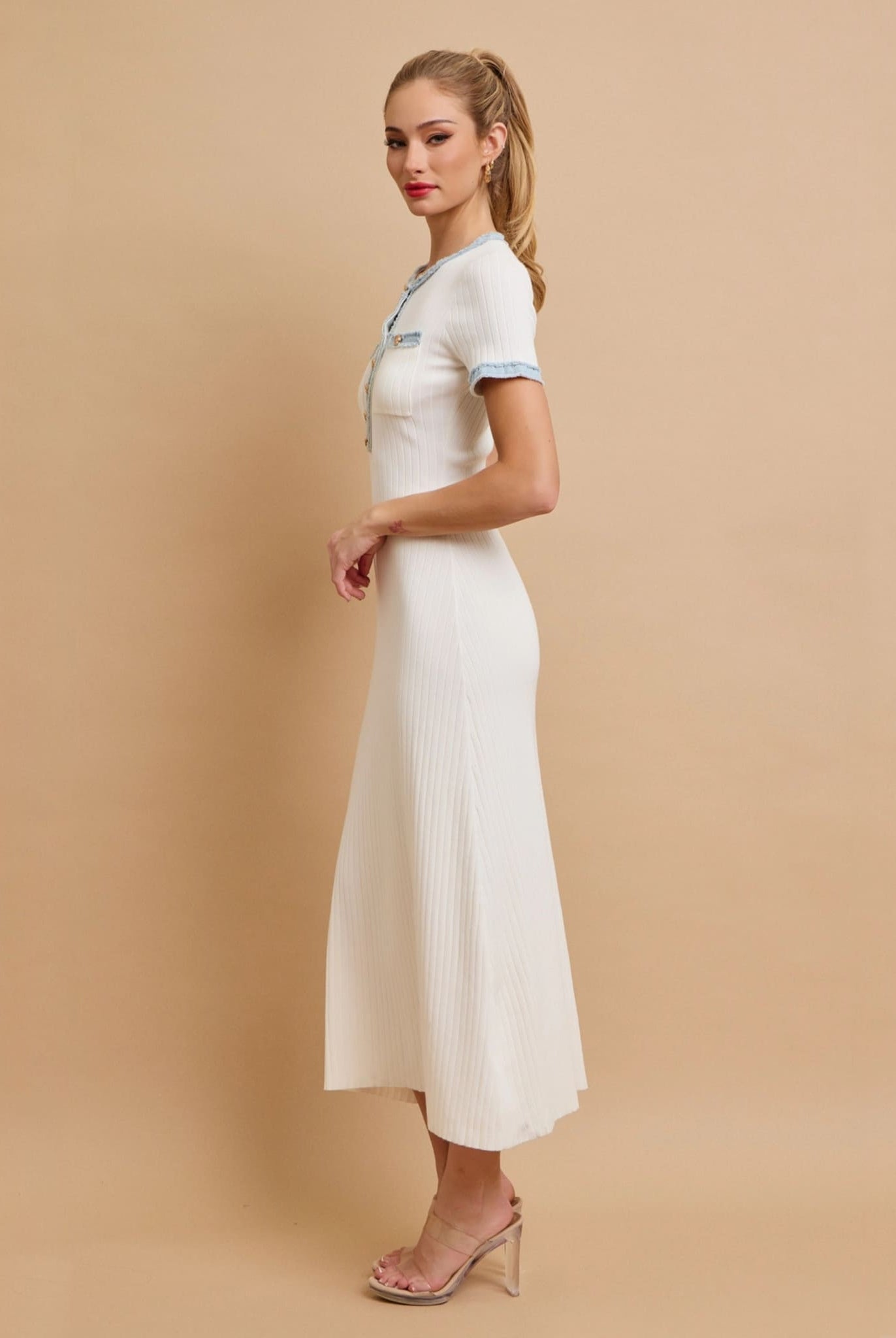 White knit midi dress side view with short sleeves.
