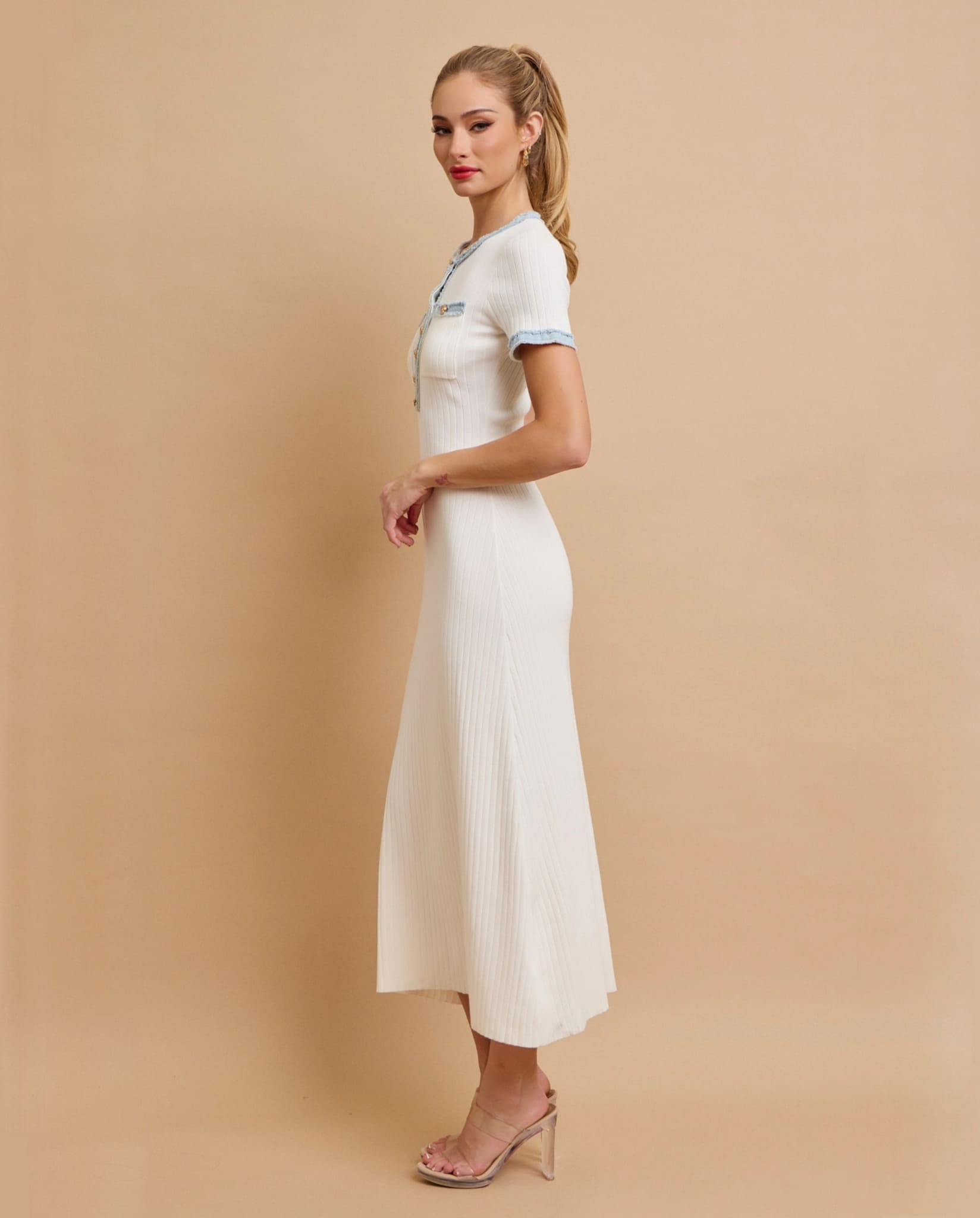 White knit midi dress side view with short sleeves.