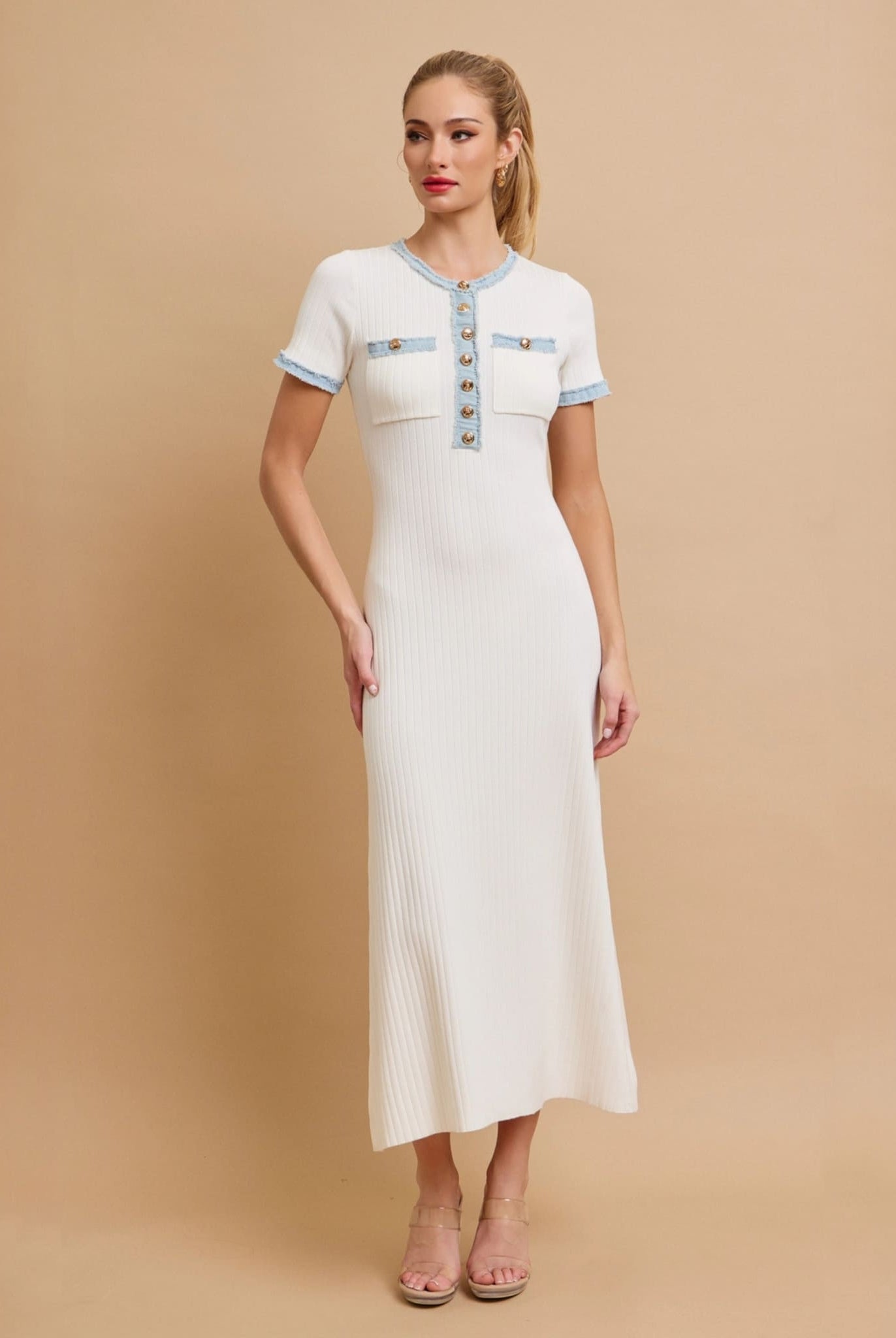 White ribbed knit dress with denim placket and gold buttons.