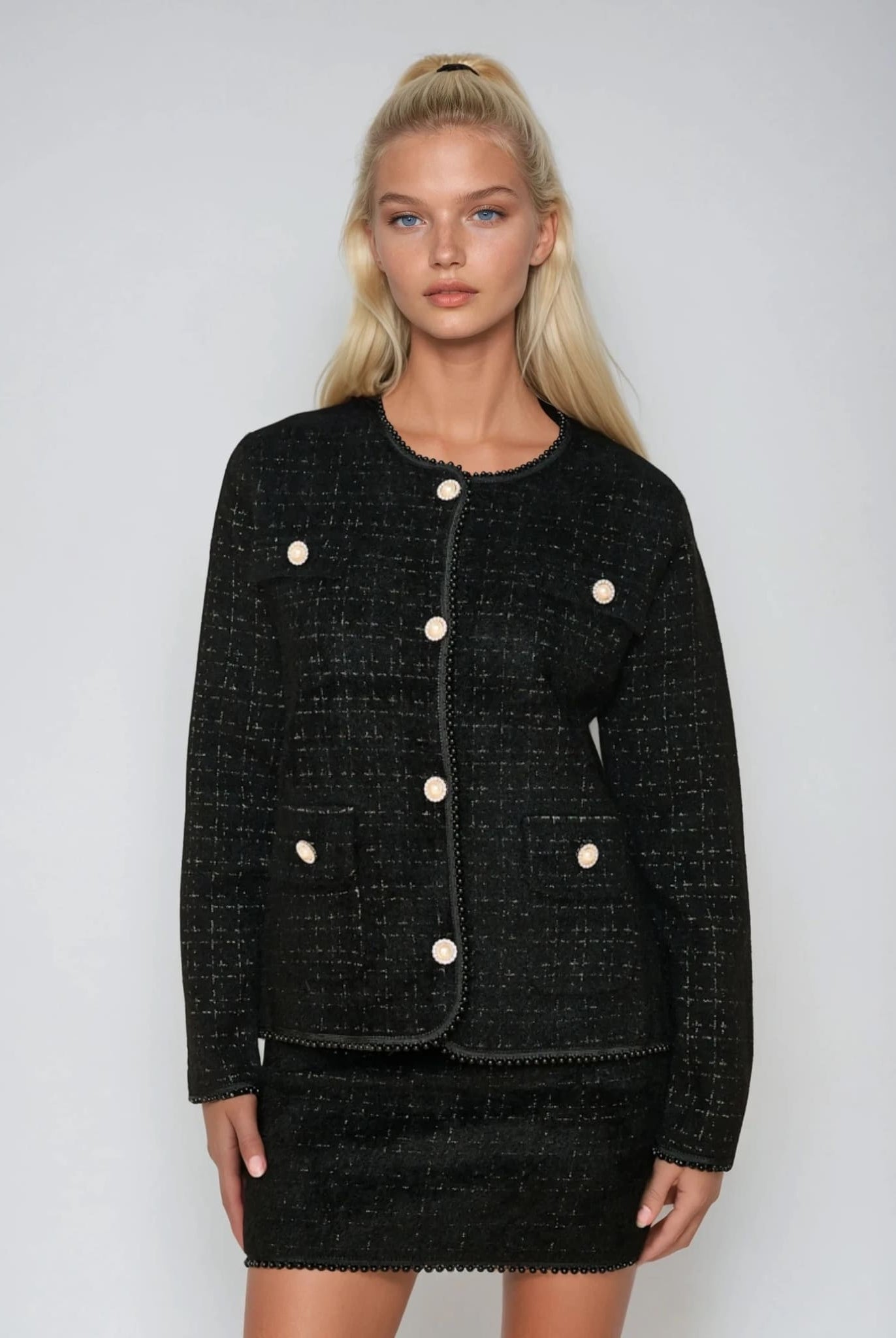 Black elegant pearl trim cardigan with pearl buttons from Coventina Collection.
