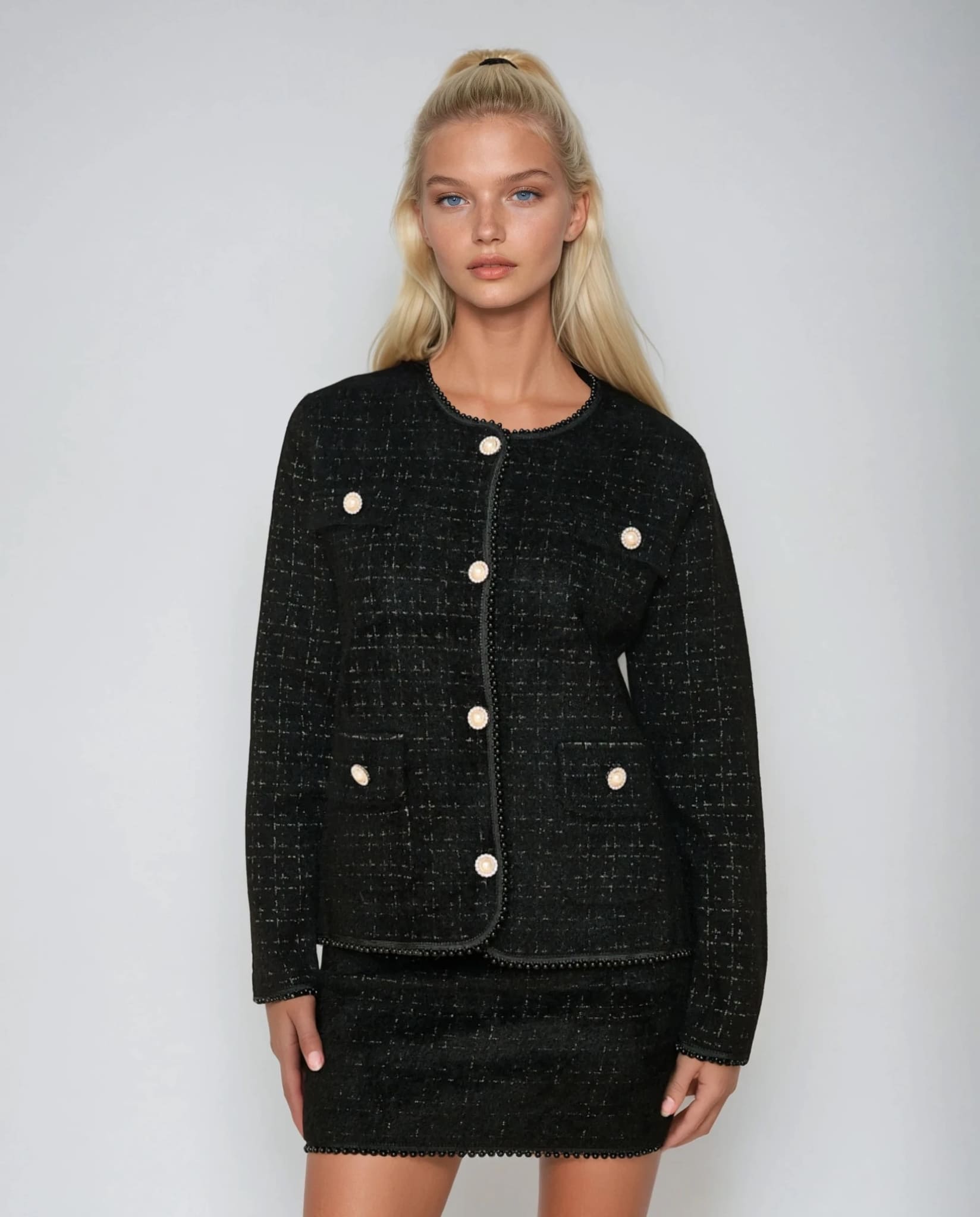 Black elegant pearl trim cardigan with pearl buttons from Coventina Collection.