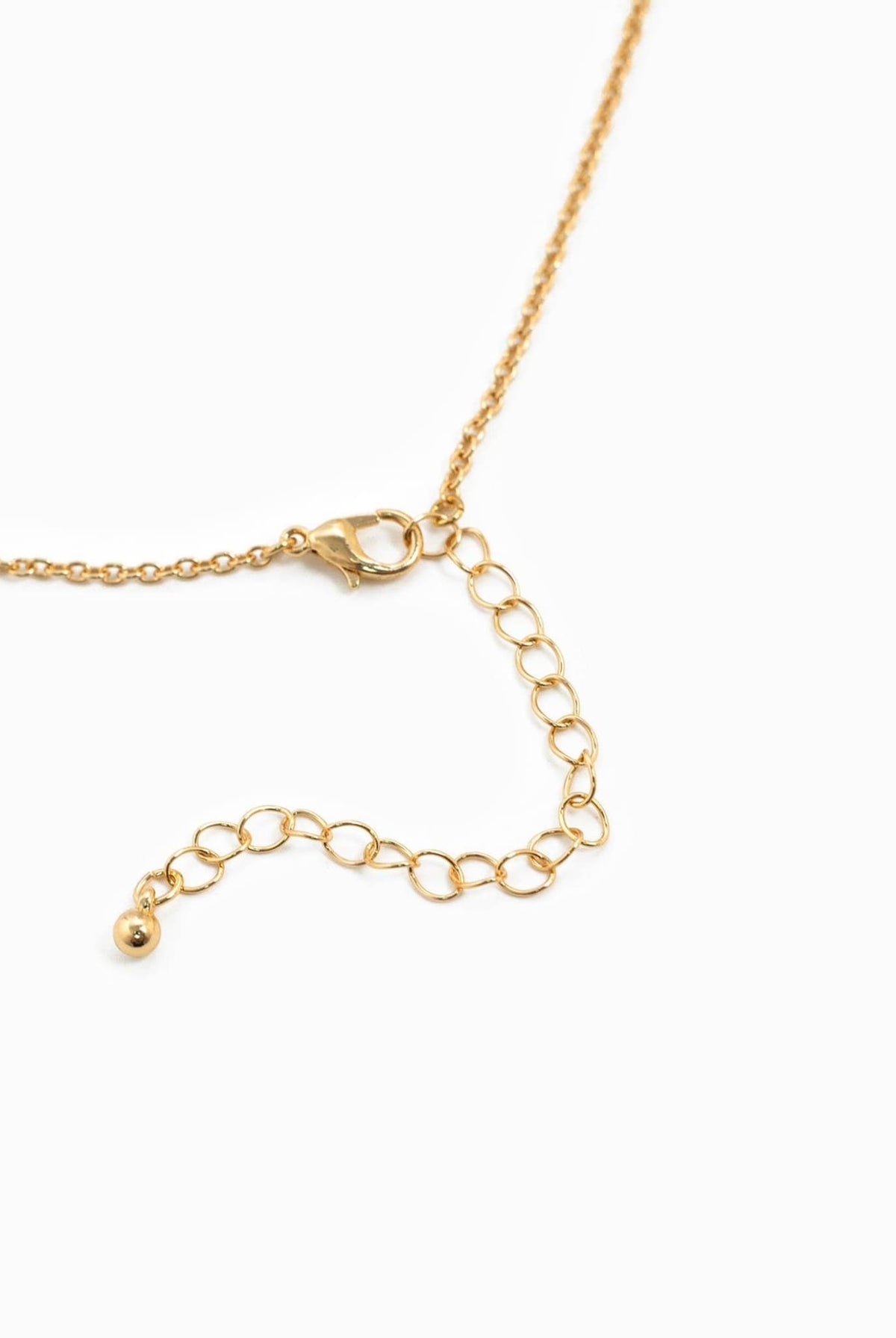 Gold horse bit necklace with adjustable chain and lobster clasp.