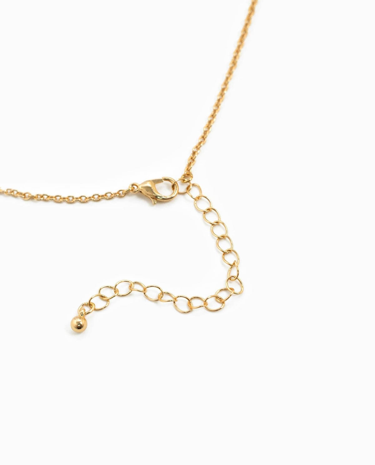 Gold horse bit necklace with adjustable chain and lobster clasp.