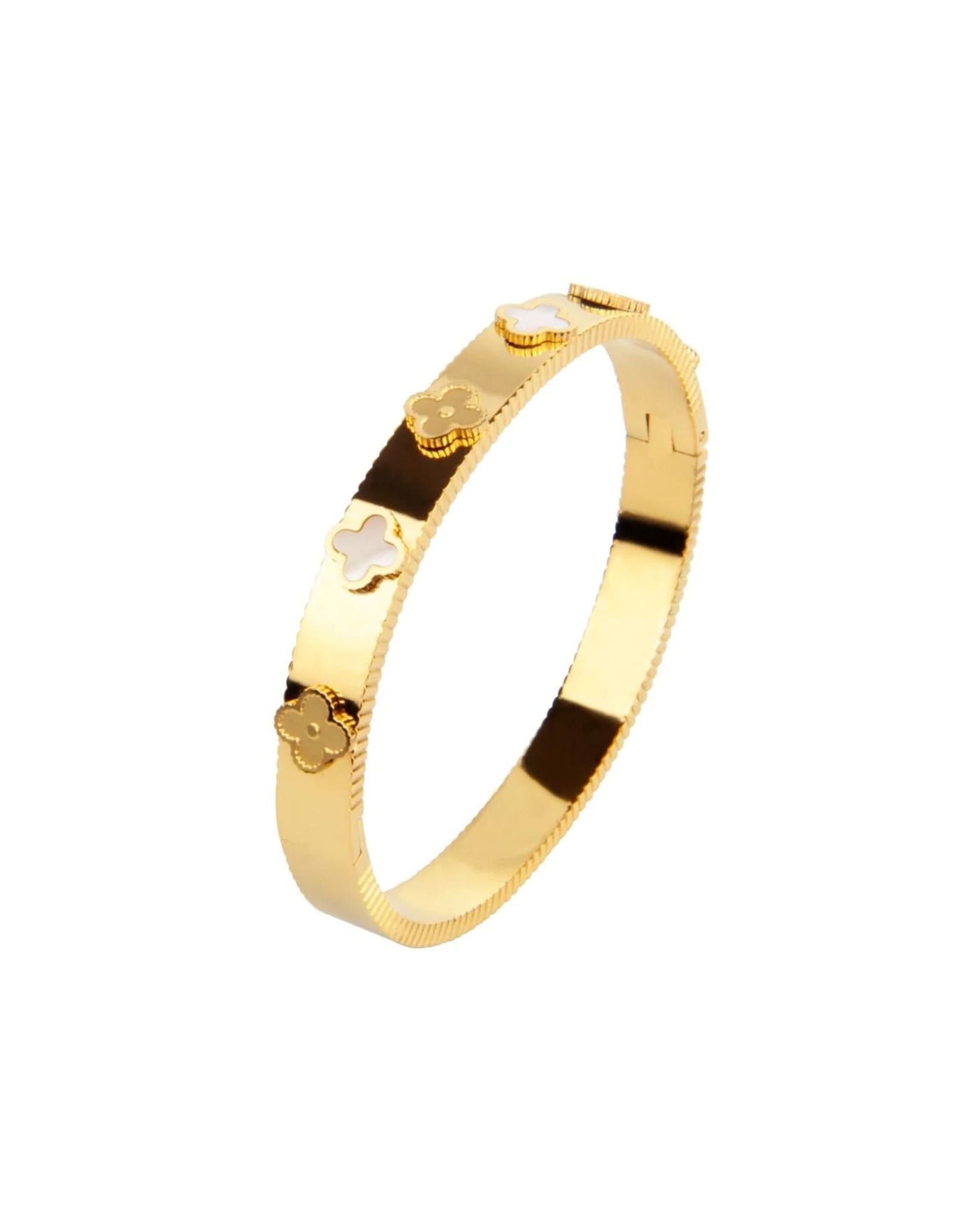 Women's gold bangle bracelet with clover details from Coventina Collection.
