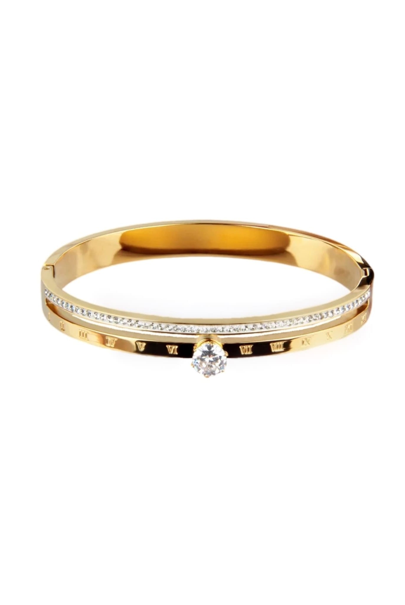 Gold bangle bracelet with Roman numerals, sparkling rhinestones, and a center stone.