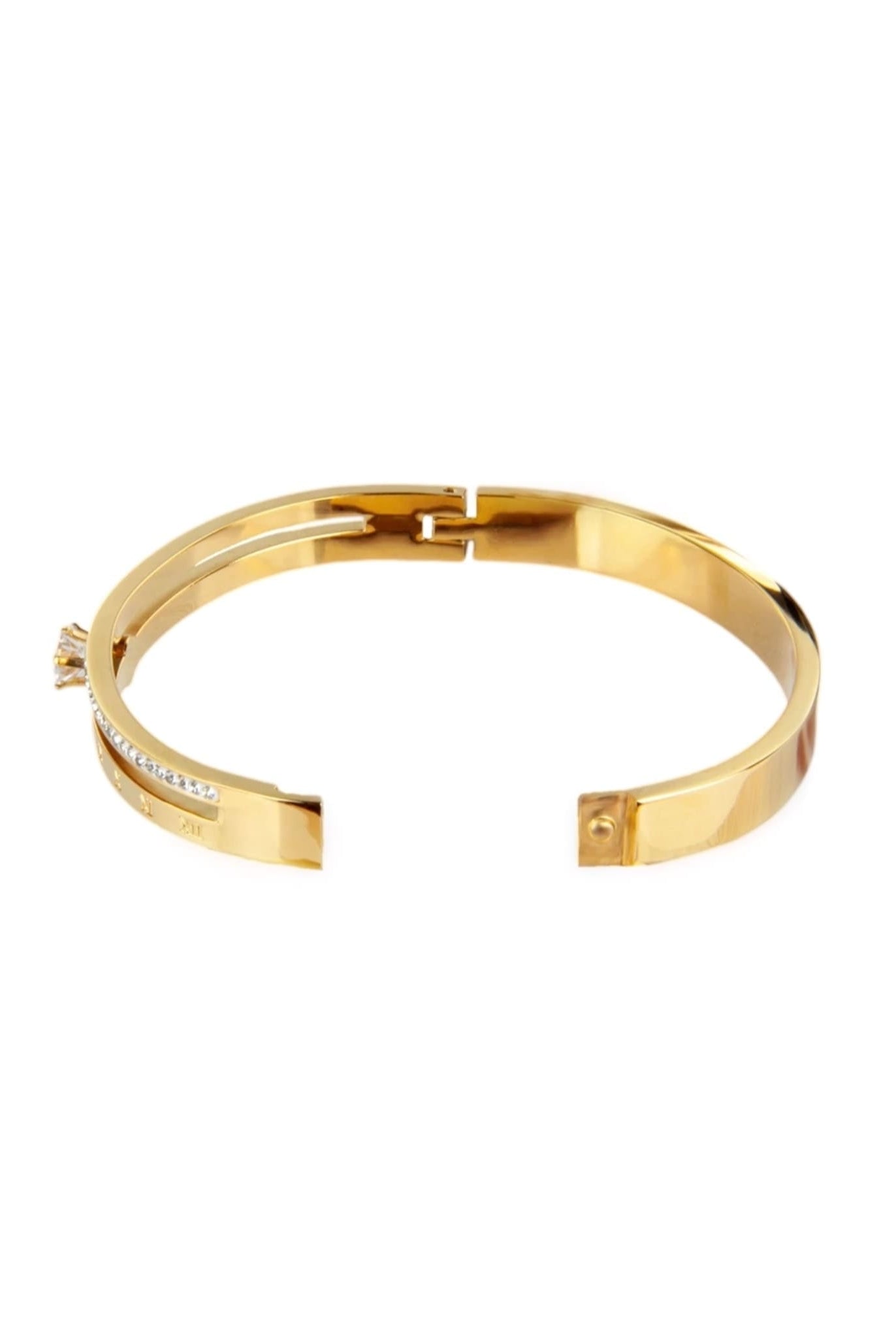 Gold bangle bracelet with Roman numeral details and an open clasp.