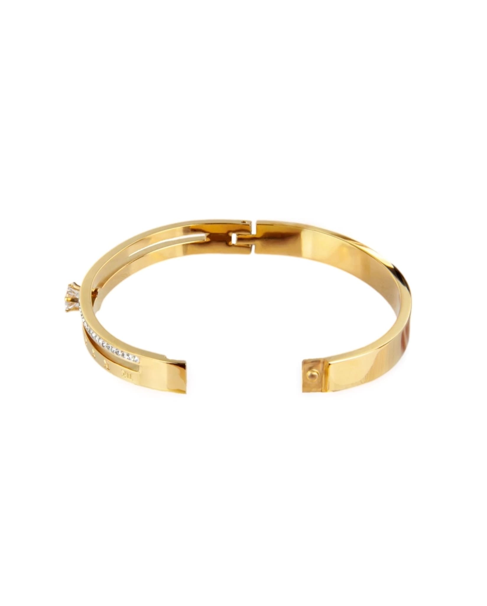 Gold bangle bracelet with Roman numeral details and an open clasp.