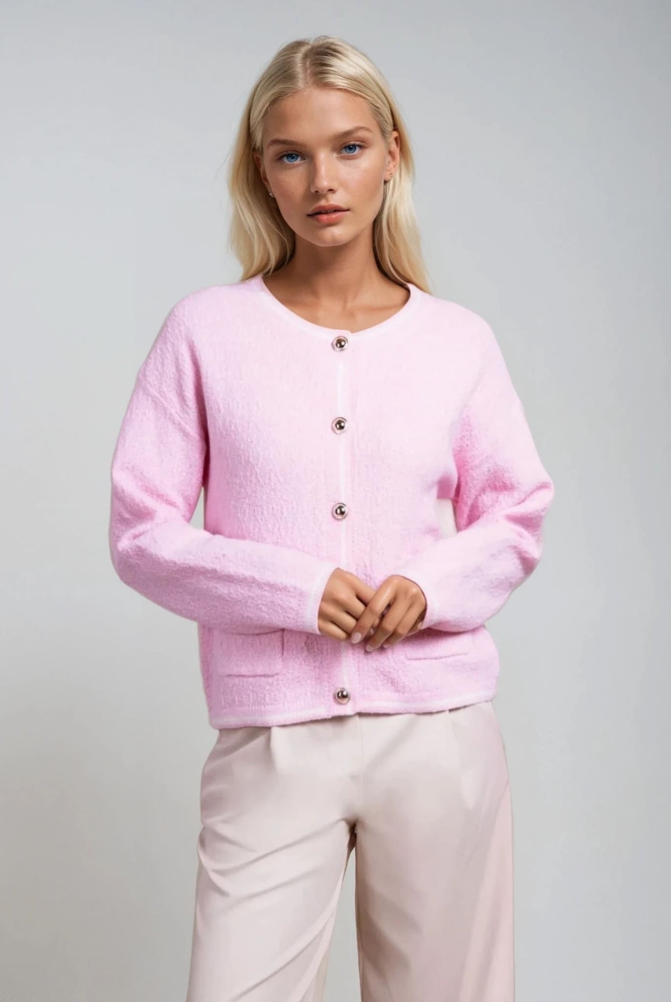 Women's powder pink textured cardigan with decorative buttons from Coventina Collection.