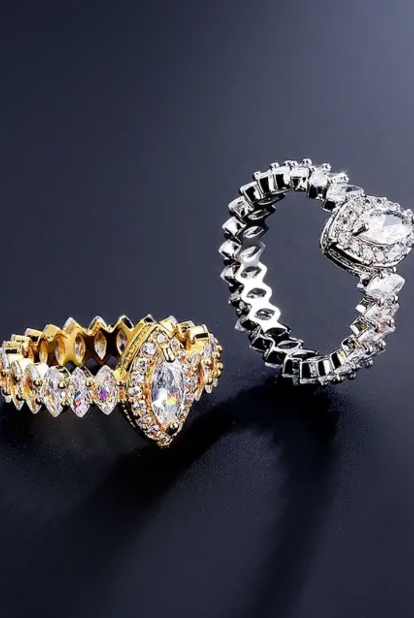 Gold and silver marquise rings with zircon stones.