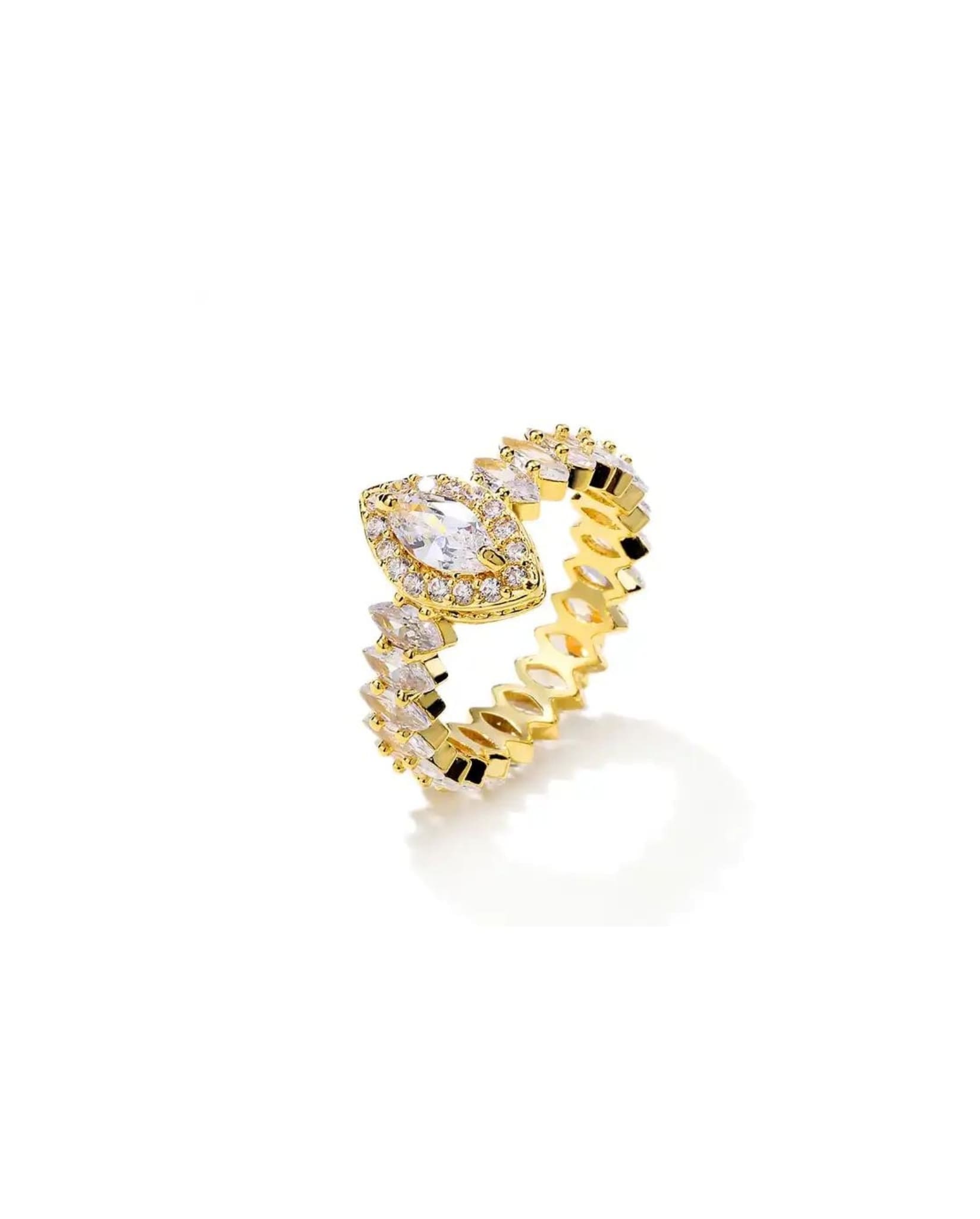 Gold sparkling marquise ring with zircon stones, featuring a marquise-cut centerpiece.