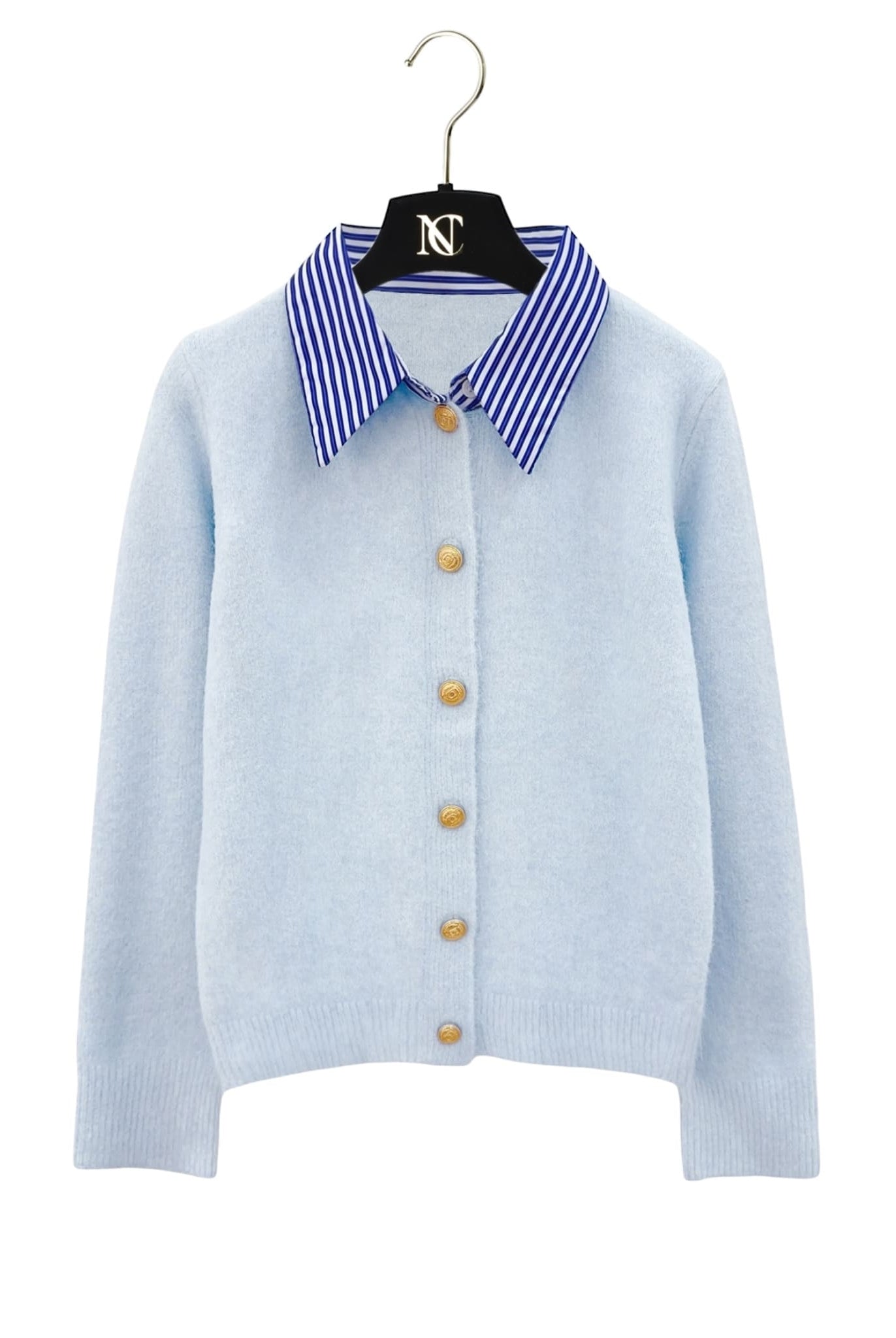 Striped collar cardigan in blue with gold buttons from Coventina Collection displayed on hanger.
