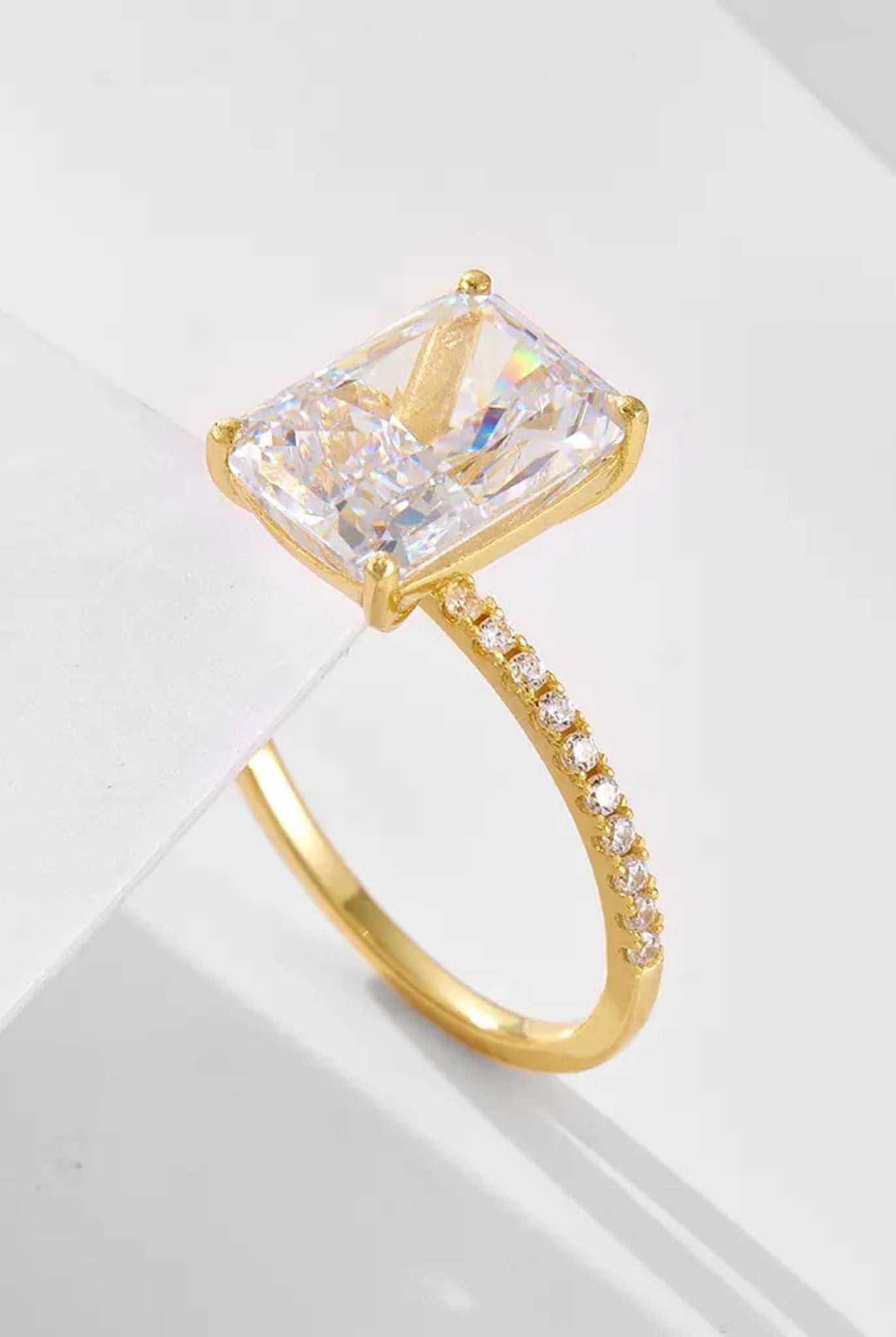 Elegant radiant-cut ring in gold from the two-piece radiant ring set.