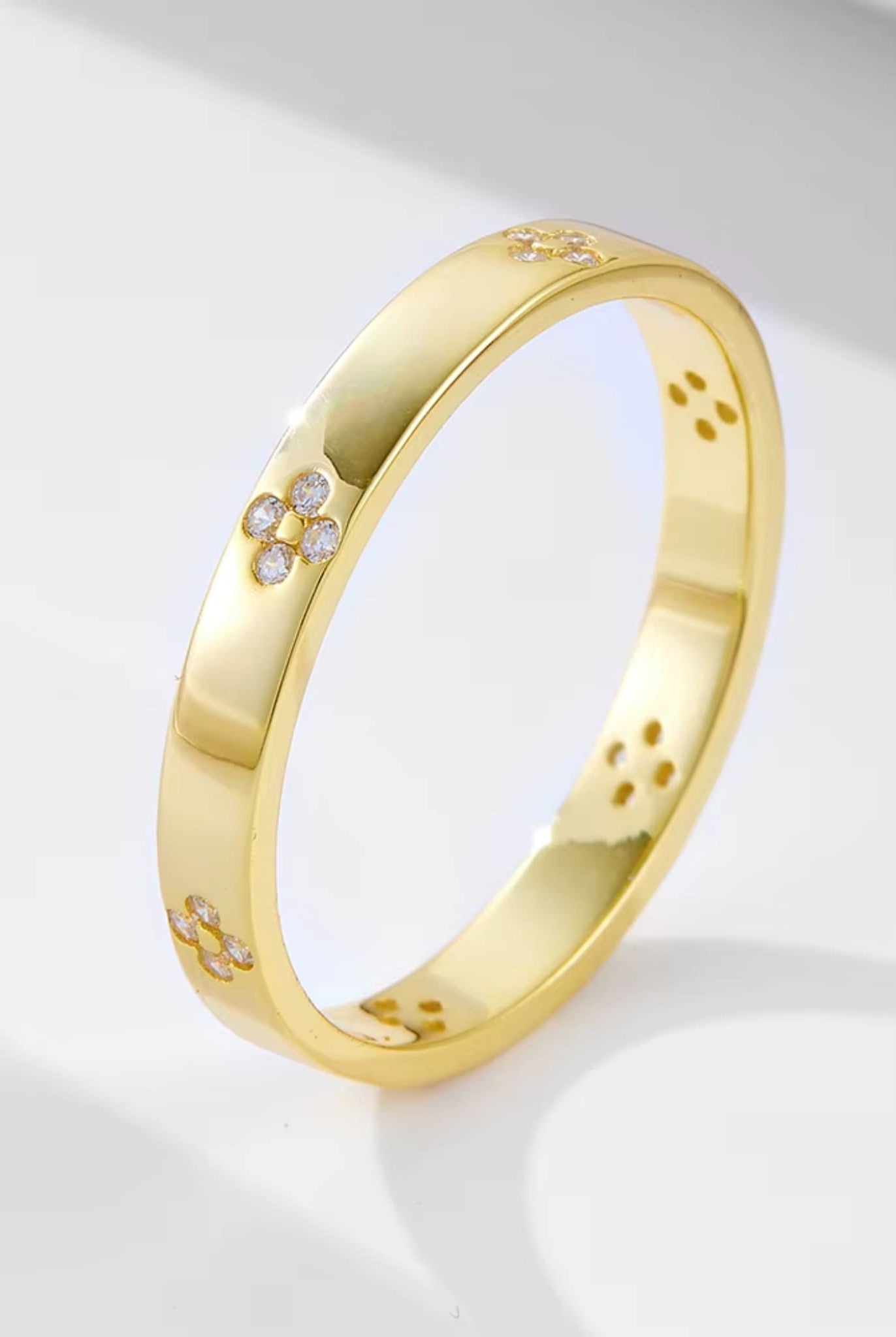 Gold band with floral diamond details from the two-piece radiant ring set.
