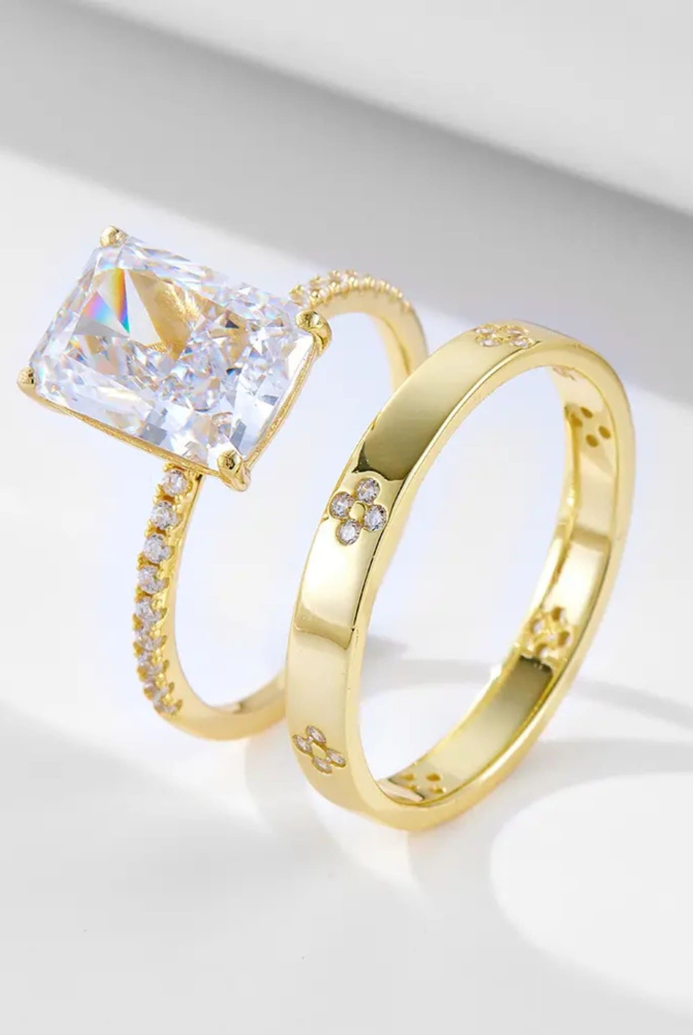 Two-piece radiant ring set with a radiant-cut stone and gold band from Coventina Collection.