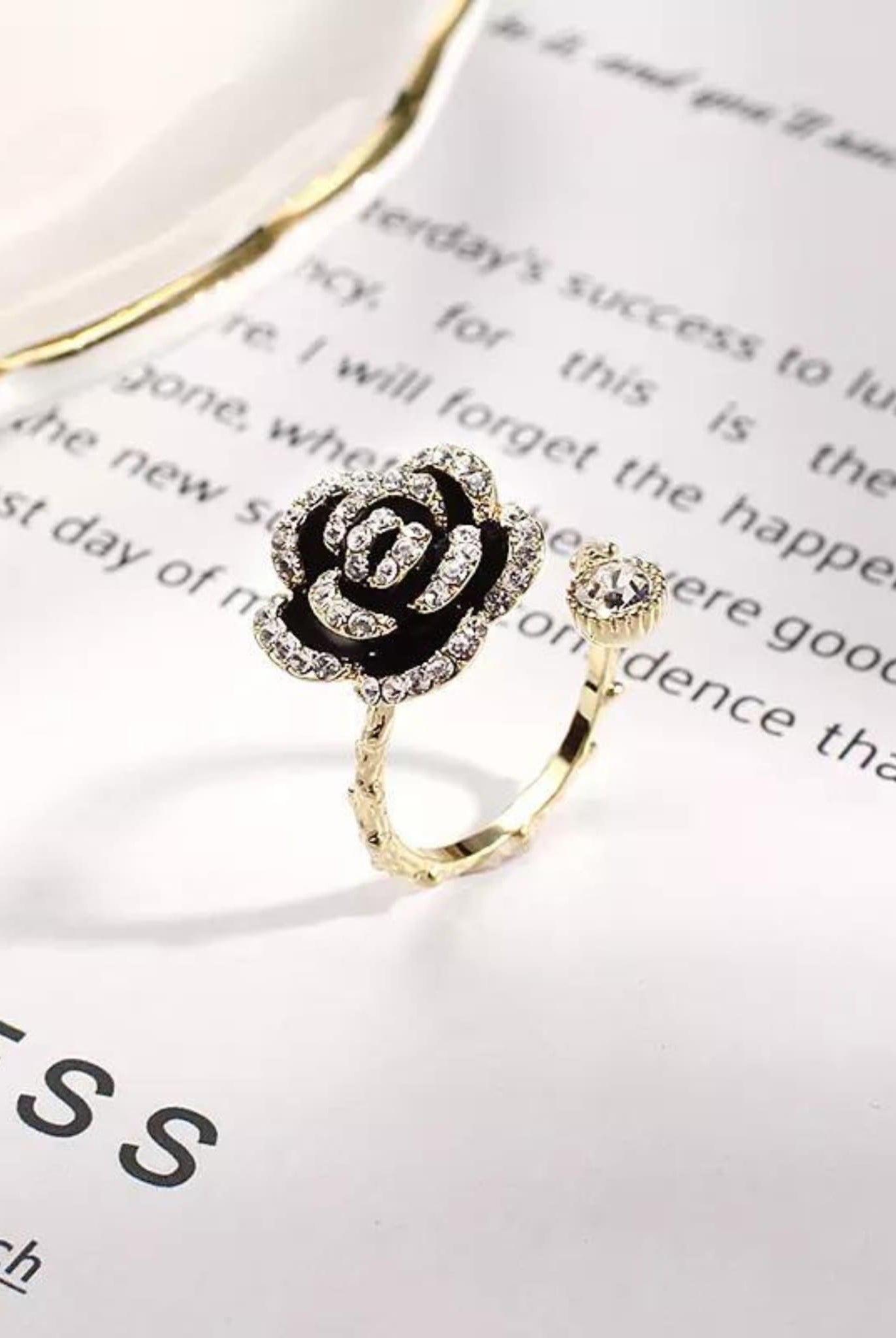 Gold Camellia Flower Ring with rhinestones and an open band.