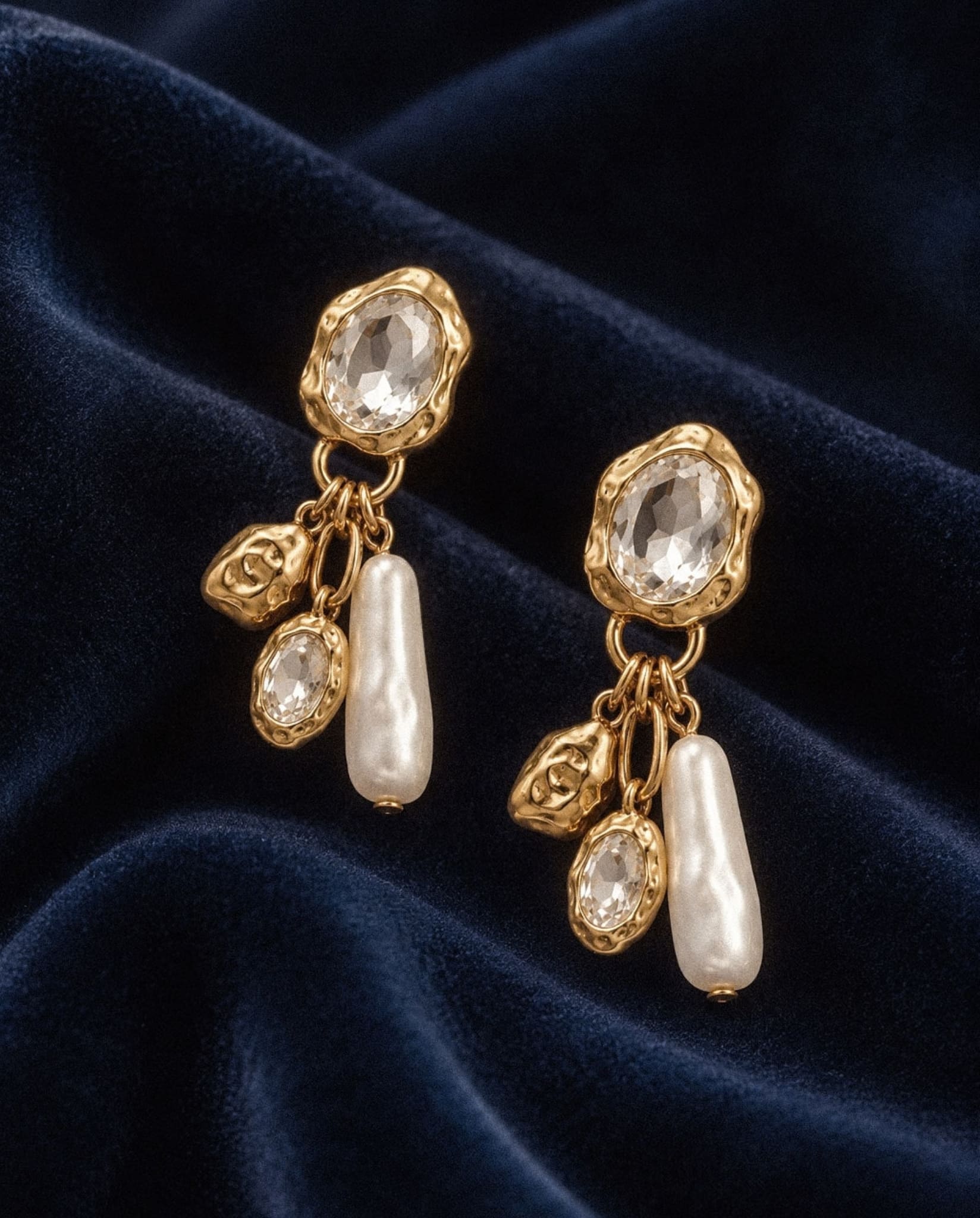Crystal & Pearl Drop Earrings with clear crystals and pearl drops on navy velvet.
