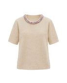 Beige knit top with crystal embellished collar.