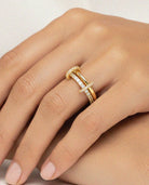 Gold-tone double band ring with sparkling pavé detailing.