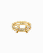 Elegant gold-tone ring with polished and pavé finishes.