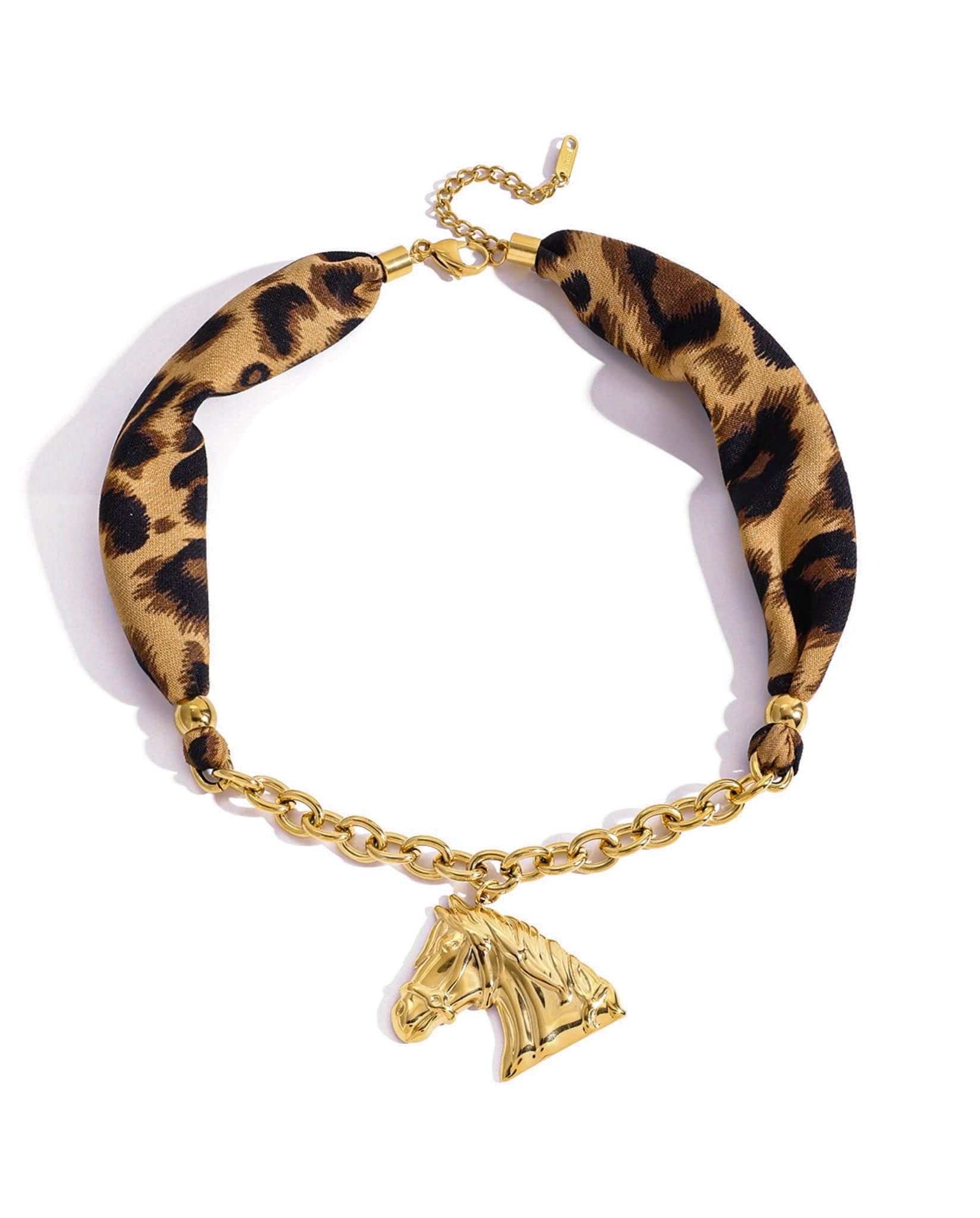 Gold-plated statement necklace flat lay - Leopard Statement Horse Necklace