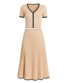 Beige pleated skirt set with black trim.
