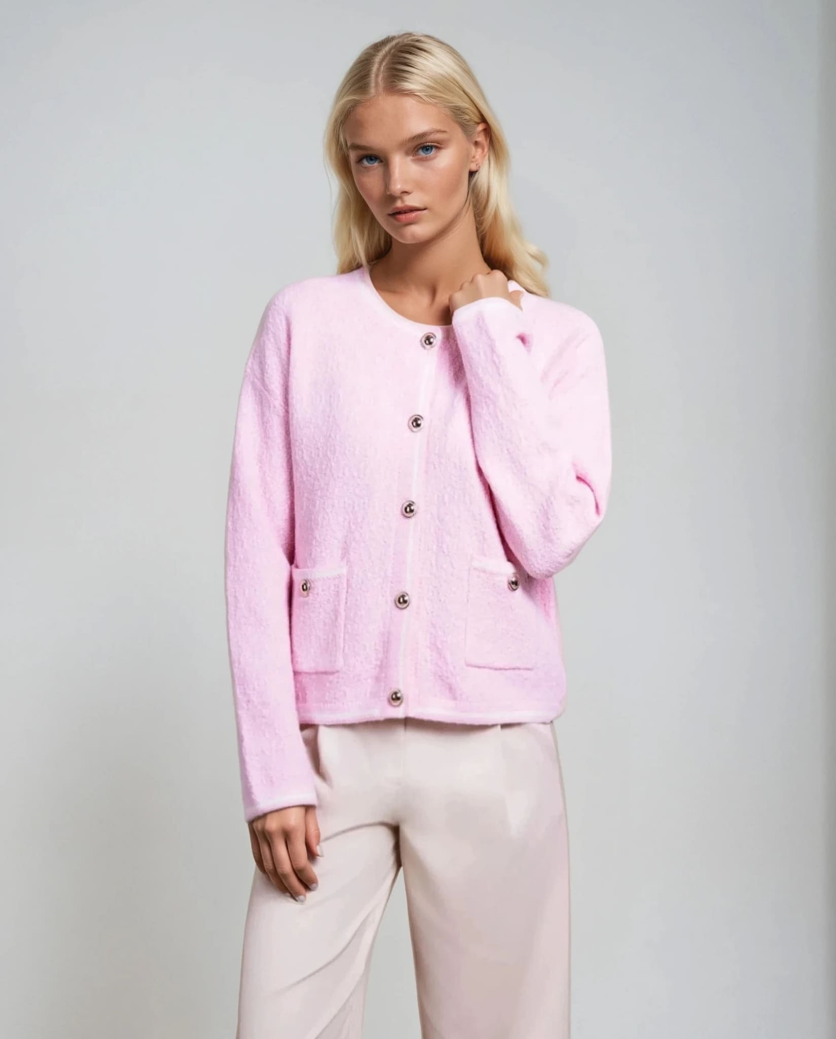 Powder pink textured cardigan for women, stylish knitwear from Coventina Collection.