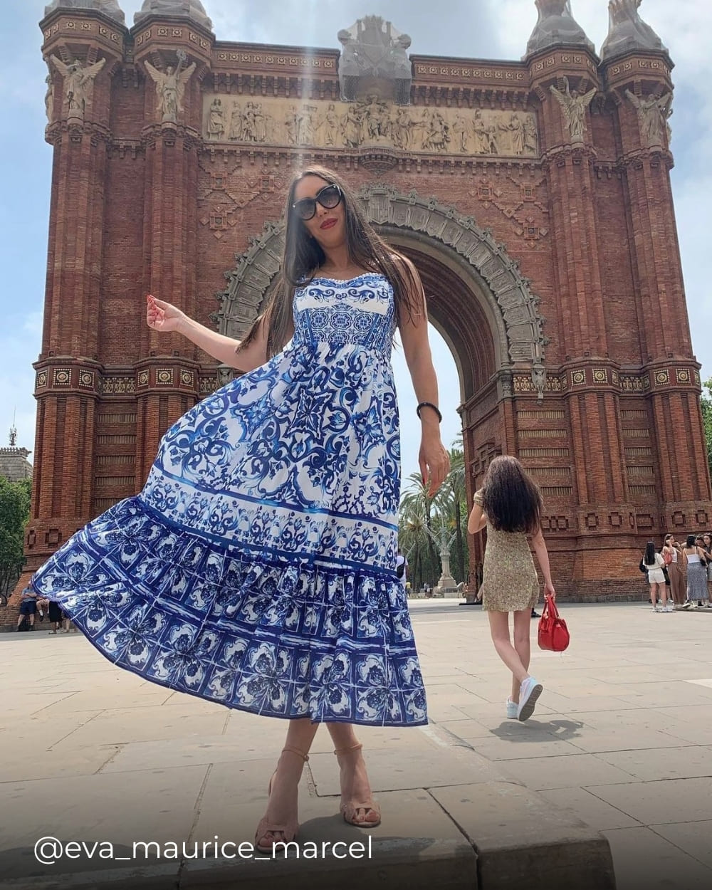 Customer wearing a blue printed summer dress from Coventina Collection