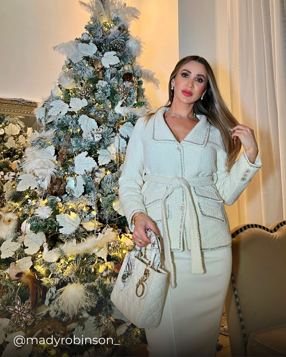 Mady wearing a white tweed jacket from Coventina Collection