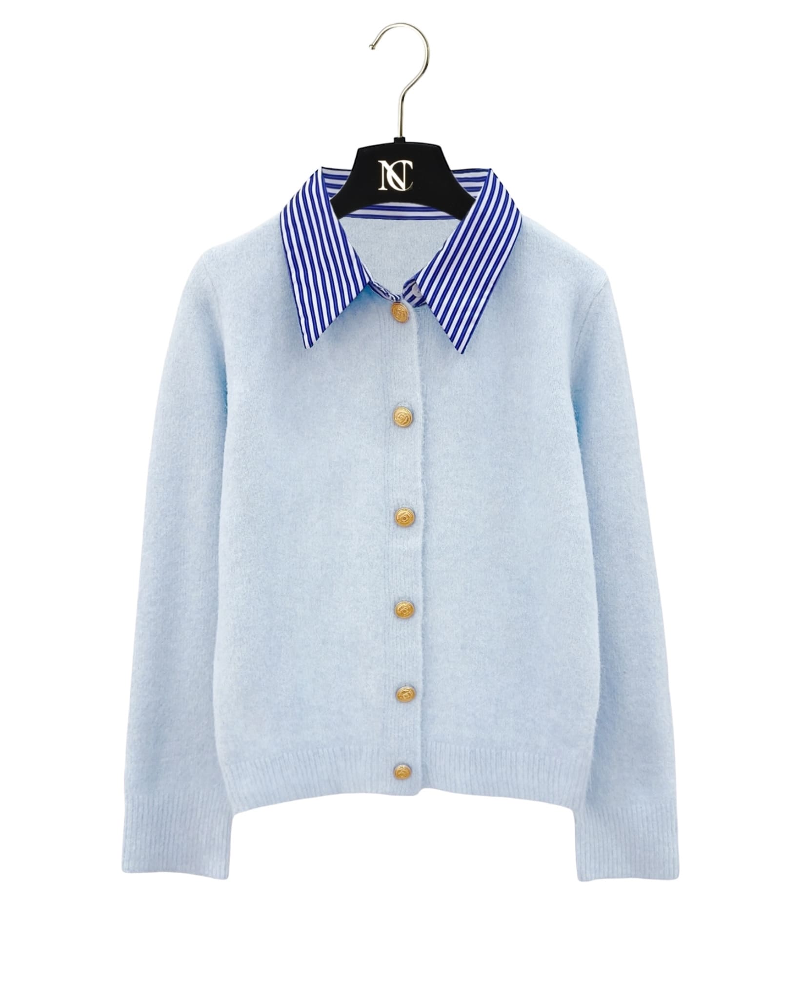 Striped collar cardigan in blue with gold buttons from Coventina Collection displayed on hanger.