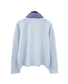 Back view of the striped collar cardigan in blue, showing soft knit fabric.