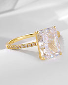 Elegant radiant-cut ring in gold from the two-piece radiant ring set, captured from a side angle.