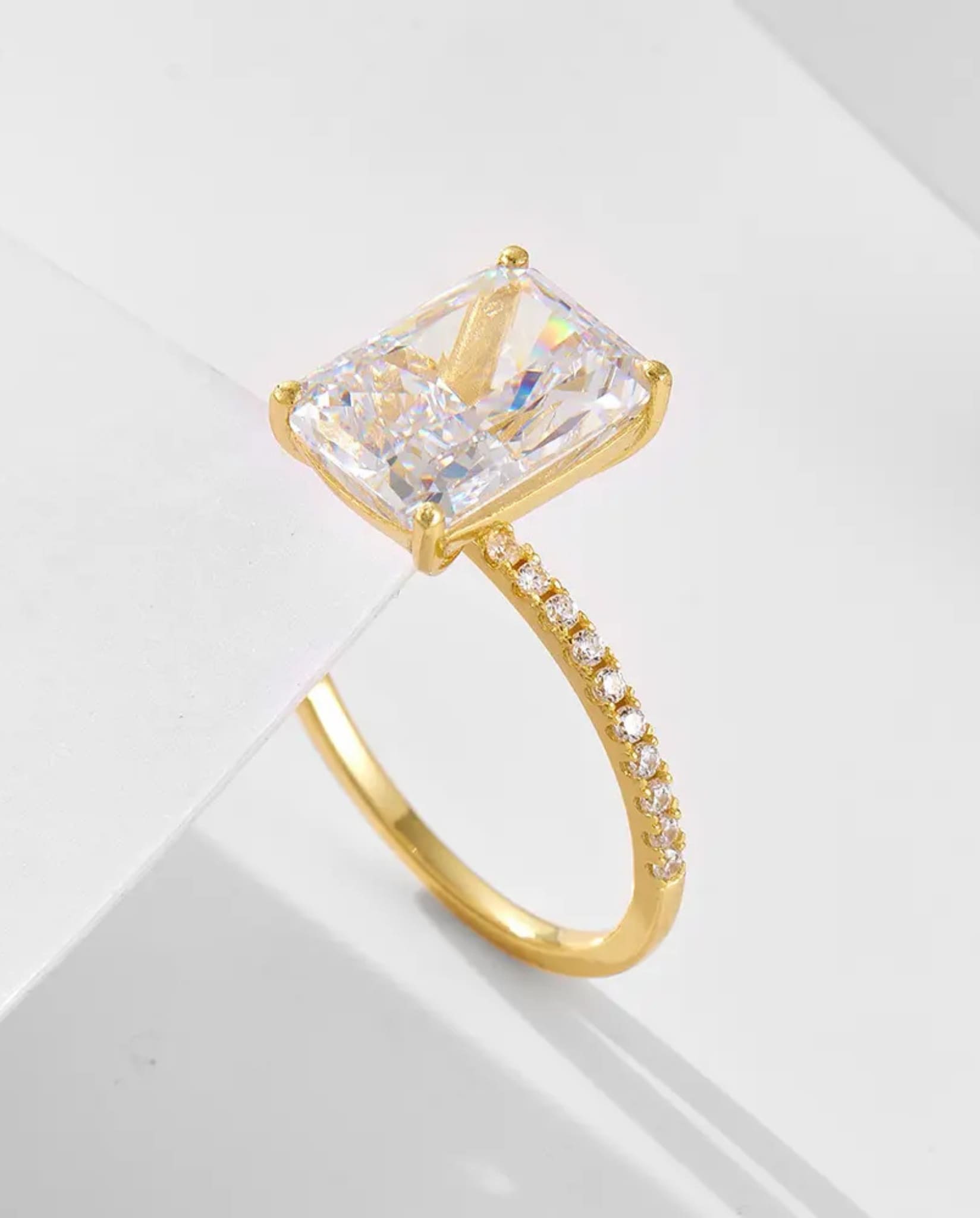 Elegant radiant-cut ring in gold from the two-piece radiant ring set.