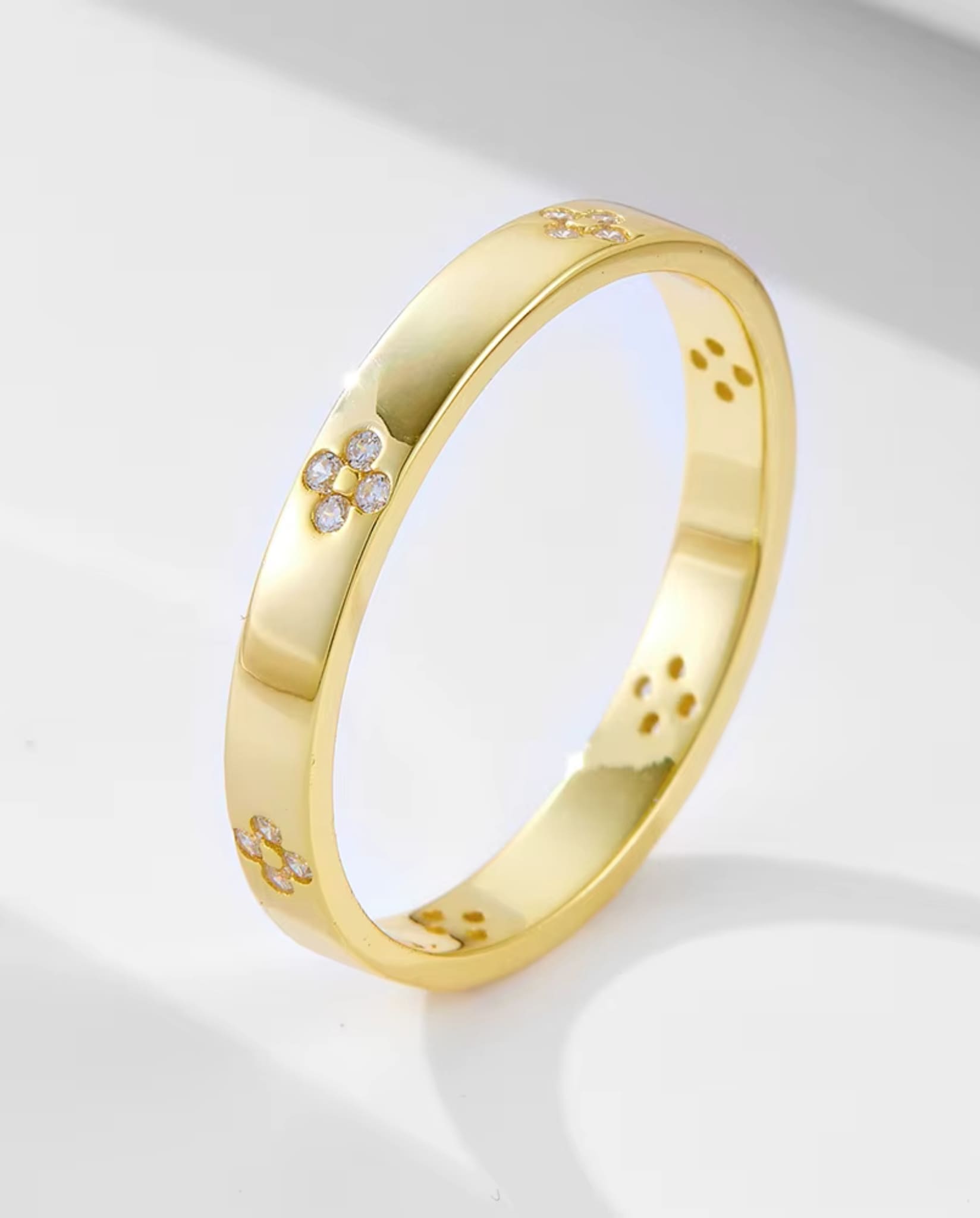 Gold band with floral diamond details from the two-piece radiant ring set.