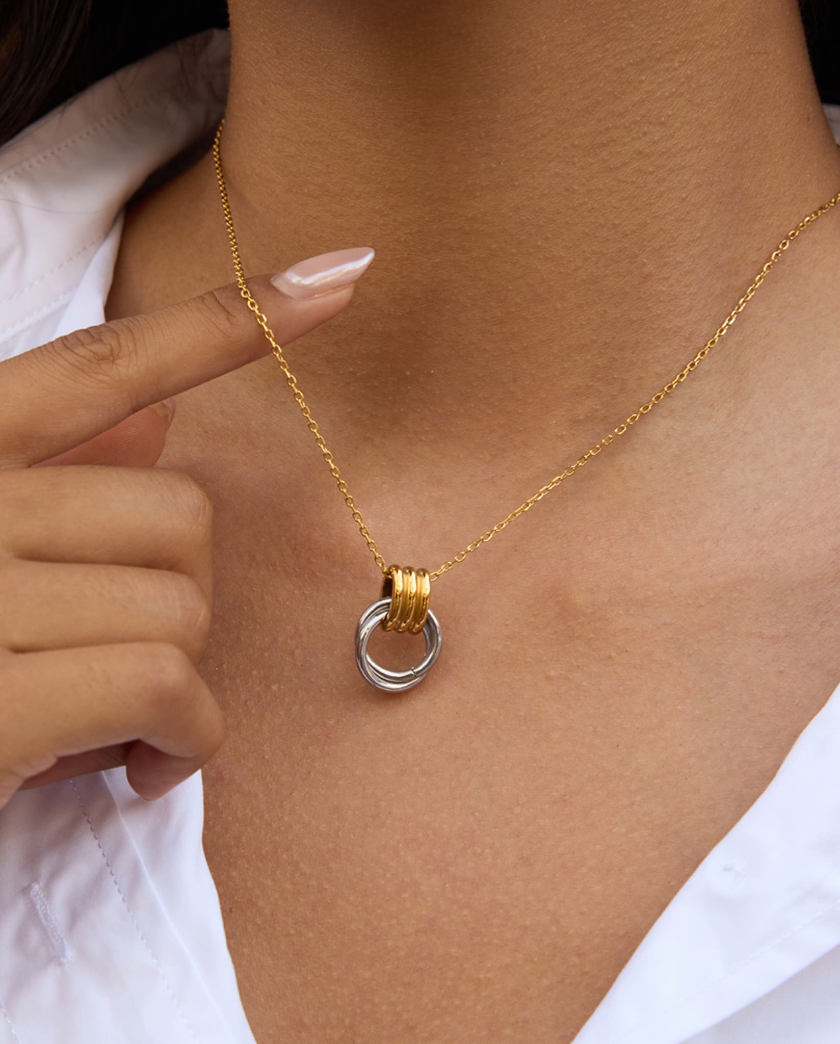 Minimal two-tone necklace worn on model with gold chain and silver ring detail - Two-Tone Knot Necklace