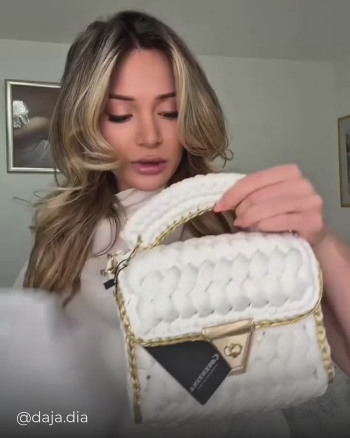 Dayana showcasing the ivory crochet bag from Coventina Collection